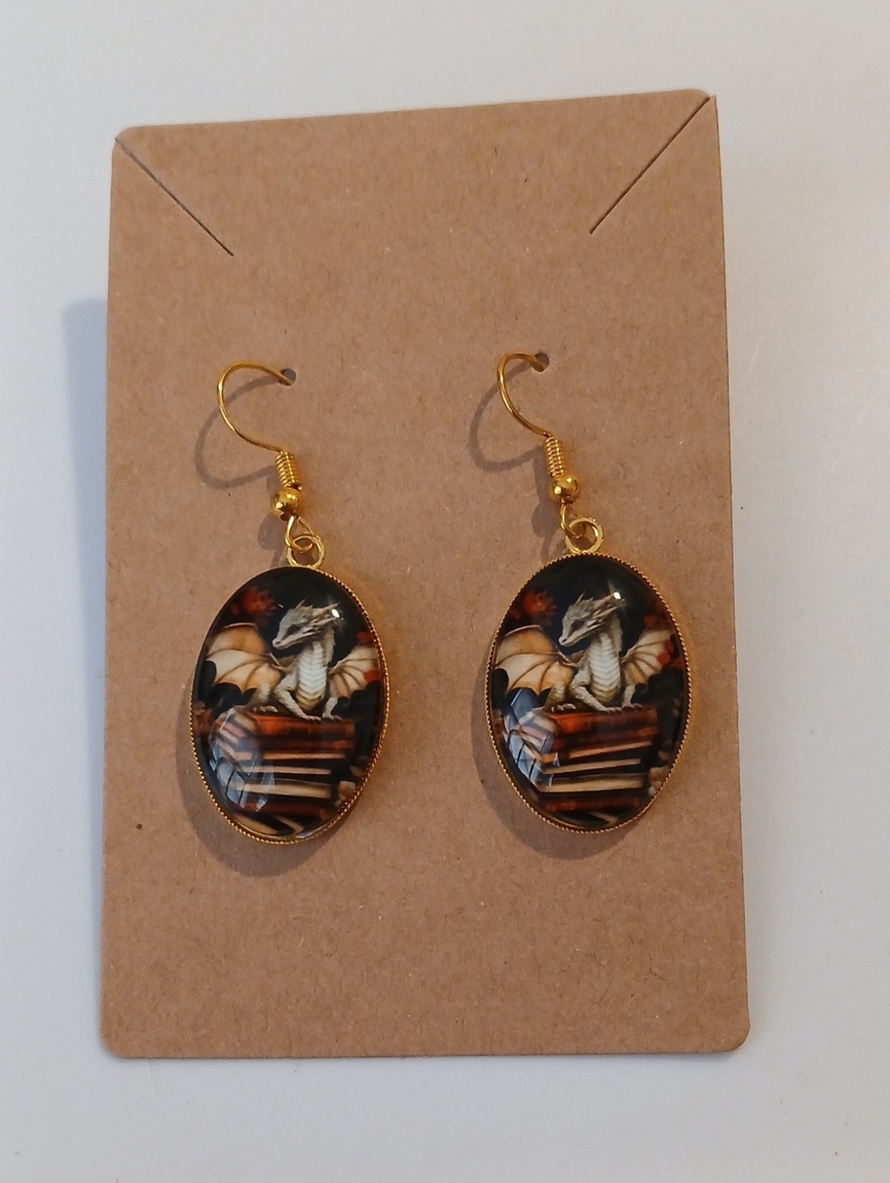 Fashion Jewelry Gold-Tone Oval Dragon Book Earrings with Black and Cream Accents